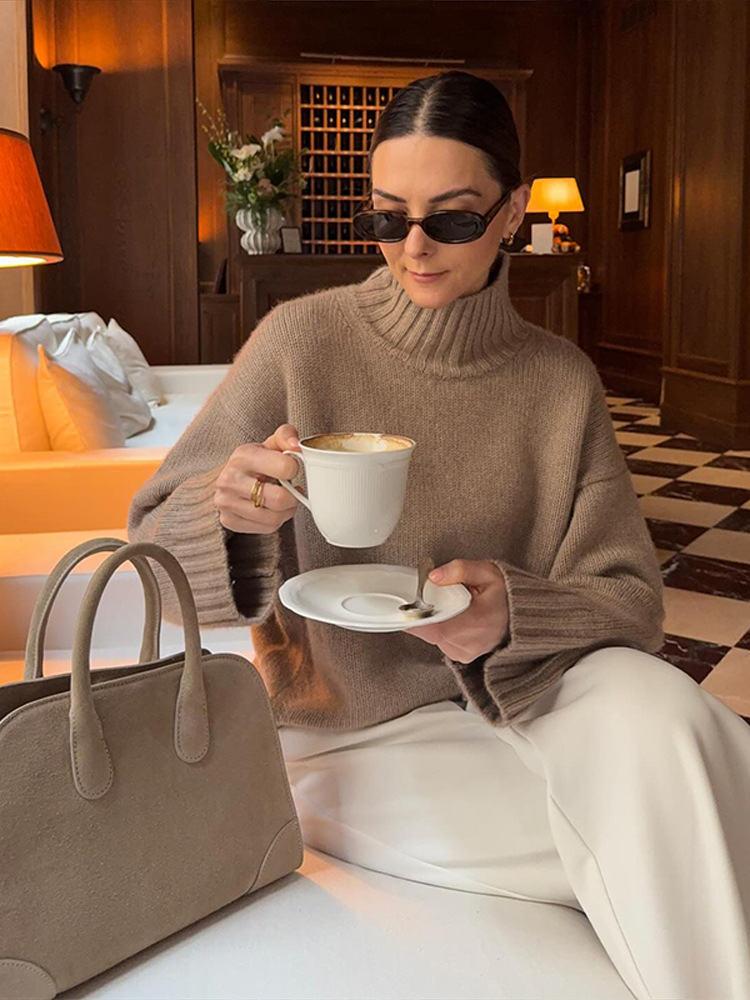 Simple estilo de alta sensación suelta de cuello alto color sólido suéter de manga larga para mujeres 2025 otoño y invierno nuevo estilo transfronterizo europeo y americano