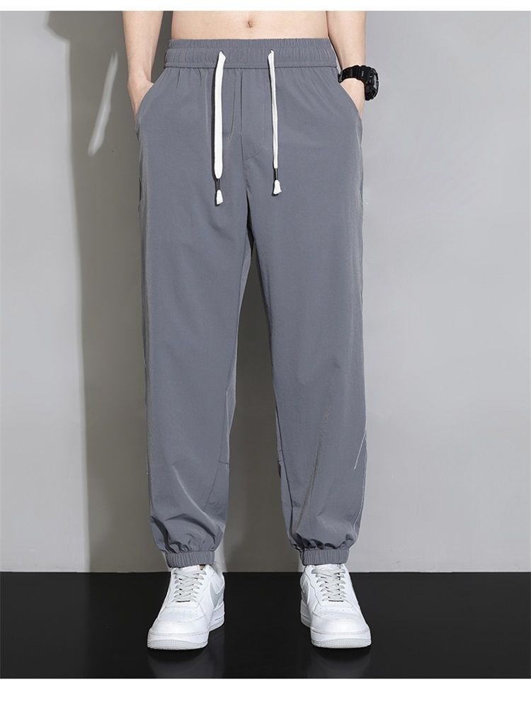 Quần jogger nam bo gấu dài ống bó, chất liệu băng lụa mỏng mùa hè, form rộng thùng thình, phong cách thể thao, nhiều size từ M đến 8XL — màu đen, màu xám đậm, màu kaki chi tiết 23