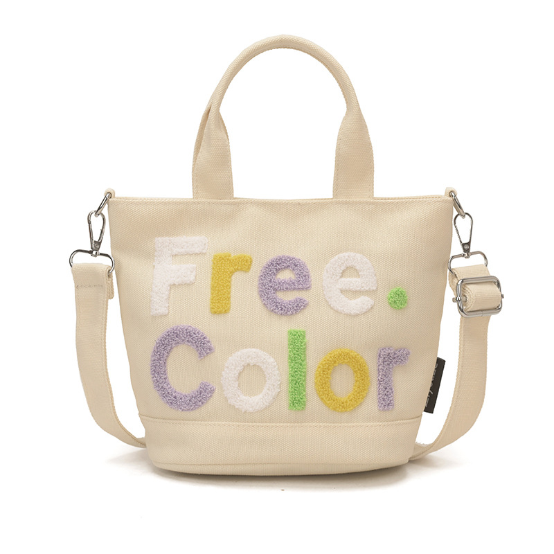 Mamá bolso para salir bolso de cubo de mano mujer 2026 nuevo bolso de lona bordado de dibujos animados letras casuales bolso de mochila