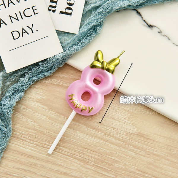Fuchsia candle with bow
