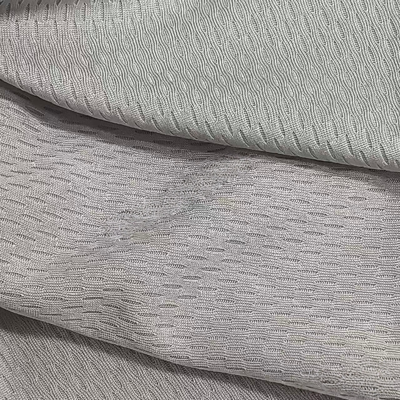 Tejido de ojo de pájaro de poliéster nueve grados absorción de sudor tela de malla de secado rápido poliéster tela de camiseta de arroz