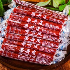 サンザシ巻き果丹皮旧式レトロな子供の頃、砂糖漬けの果物の干しサンザシ製品のカジュアルなお菓子を巻きました。