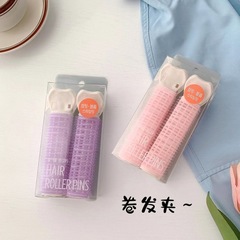 髪のふわふわした神器の髪巻き器は額の前髪を固定します。