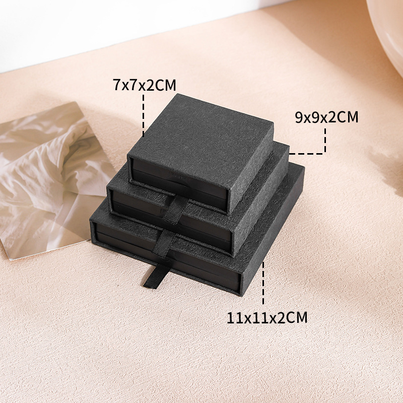 Black wood engraved pattern (built-in black suspension box); 7*7*2cm (inner box size)