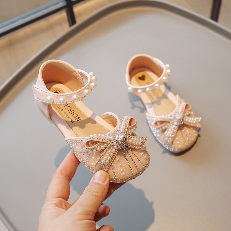 Zapatos de cristal para niñas 2026 verano nuevas sandalias de cabeza de bolsillo para niños pequeños zapatos de princesa suaves zapatos de baile de niñas