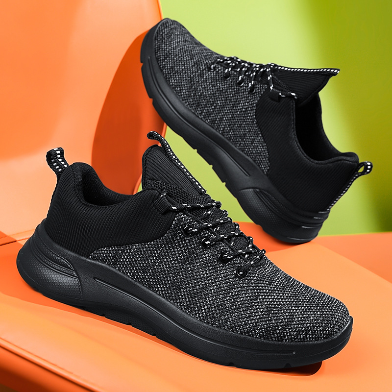 Zapatos transfronterizos de talla grande para hombre 2025 primavera y verano zapatos deportivos transpirables de malla negra tejida voladora zapatos para correr casuales de viaje para hombre