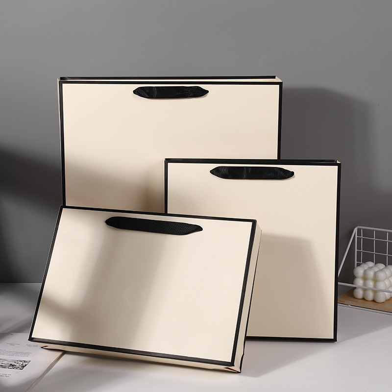 in stock Thickened White Cardboard Black Edge Gift Bag Clothing Store Shopping Bag Paper Bag Beige Handbag Exquisite Handbag in stock Thickened White Cardboard Black Edge Gift Bag Clothing Store Shopping Bag Paper Bag Beige Handbag Exquisite Handbag
