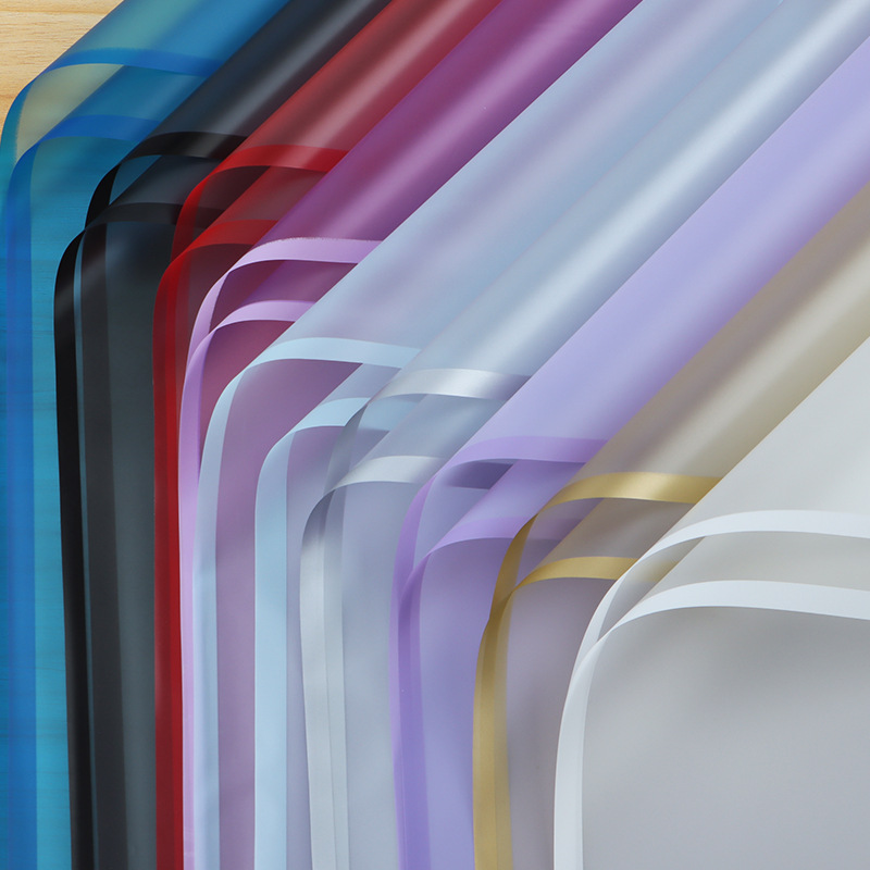 Día de San Valentín chino Ramo impermeable Material de papel de embalaje de flores Paquete de plástico BOPP Película de flores Papel mate de borde de color