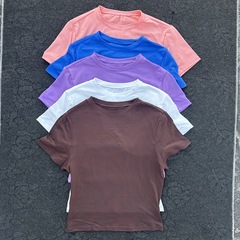 女性の丸首のタイトな体の速乾のフィットネスの上着のヨガはタイトな腹のtシャツの半袖を着て臍を現して身を修めるのがやせています。