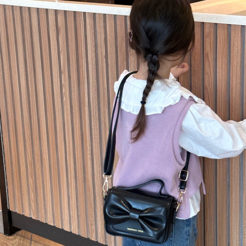 2025 nuevo bolso para niños mini accesorios para niños bolsos de mano simple color sólido arco extranjero bolso de hombro para niñas