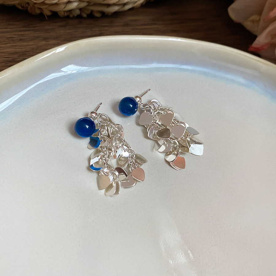 Aguja de plata-azul oscuro