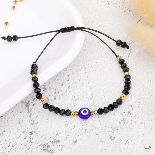 11#-B2124 gold beads black eyes