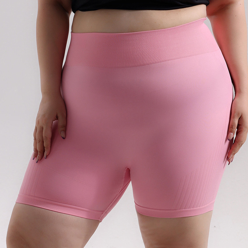 Pantalones cortos de cadera de melocotón deportivos sin costuras de gran tamaño europeos y americanos