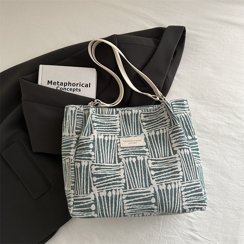 Bolso a rayas casual de todos los partidos de nicho para mujer 2024 nuevo bolso de hombro de gran capacidad de moda retro bolso de viaje