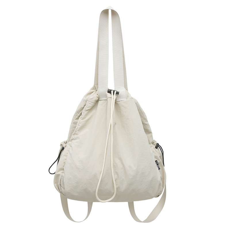 Mochila de nailon con cordón para mujer 2024 nuevo bolso de cubo de doble uso de un solo hombro literario simple para estudiantes universitarios