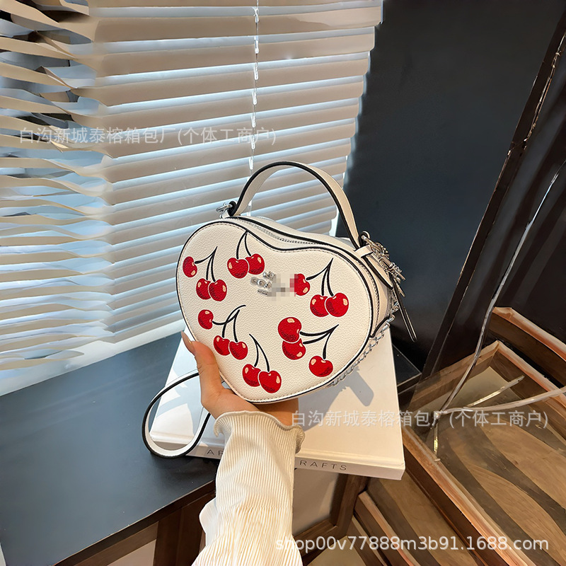 Bolso de mano en forma de corazón de comercio exterior, bolso de hombro de impresión de moda creativa, bolso de hombro simple, bolso de hombro de dama de Europa y América.