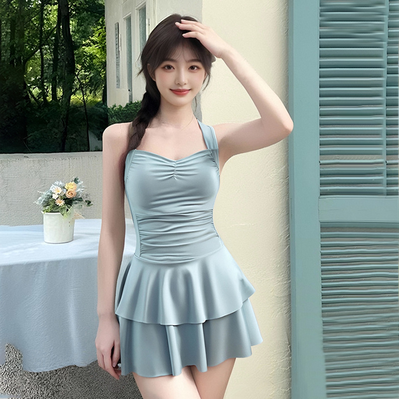 Nuevo traje de baño femenino de una pieza de color sólido cabestrillo niña dulce que cubre la carne y se ve delgado traje de baño de vacaciones de aguas termales de playa al por mayor