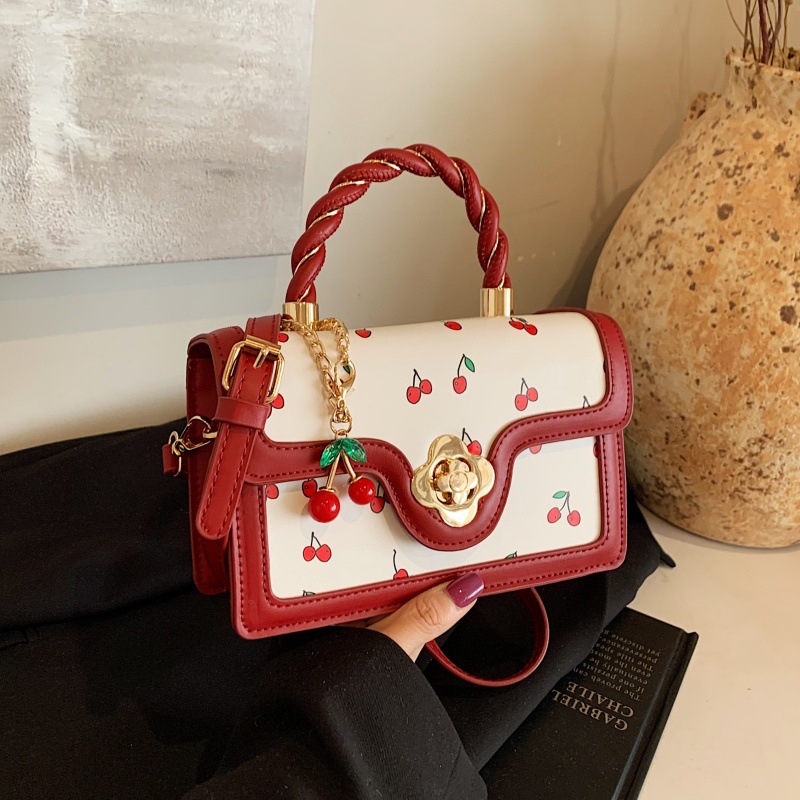 Bolso de moda coreano 2024 otoño e invierno nuevo bolso femenino lindo bolso de hombro de cereza estilo occidental color contraste bolso de mensajero marea