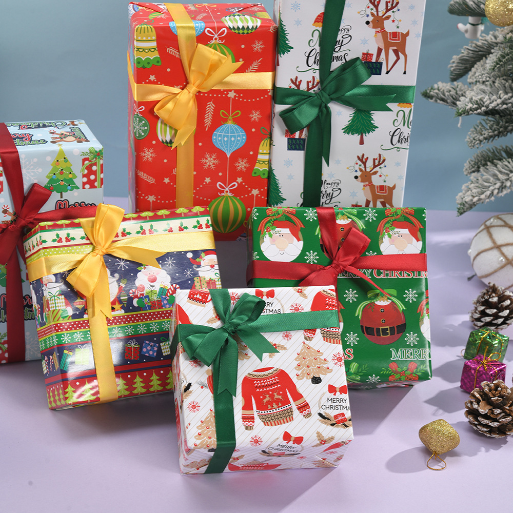 Venta caliente transfronteriza papel estucado de gran tamaño rollo de Navidad papel de regalo caja de regalo de dibujos animados papel de regalo al por mayor