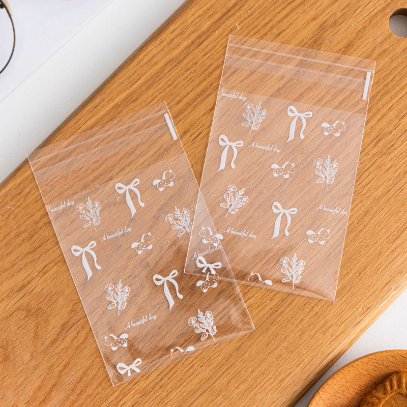 Bolsa de embalaje crujiente de copo de nieve de dibujos animados lindo transparente Bolsa autoadhesiva autoadhesiva Galletas horneadas Bolsa de embalaje pequeña individual