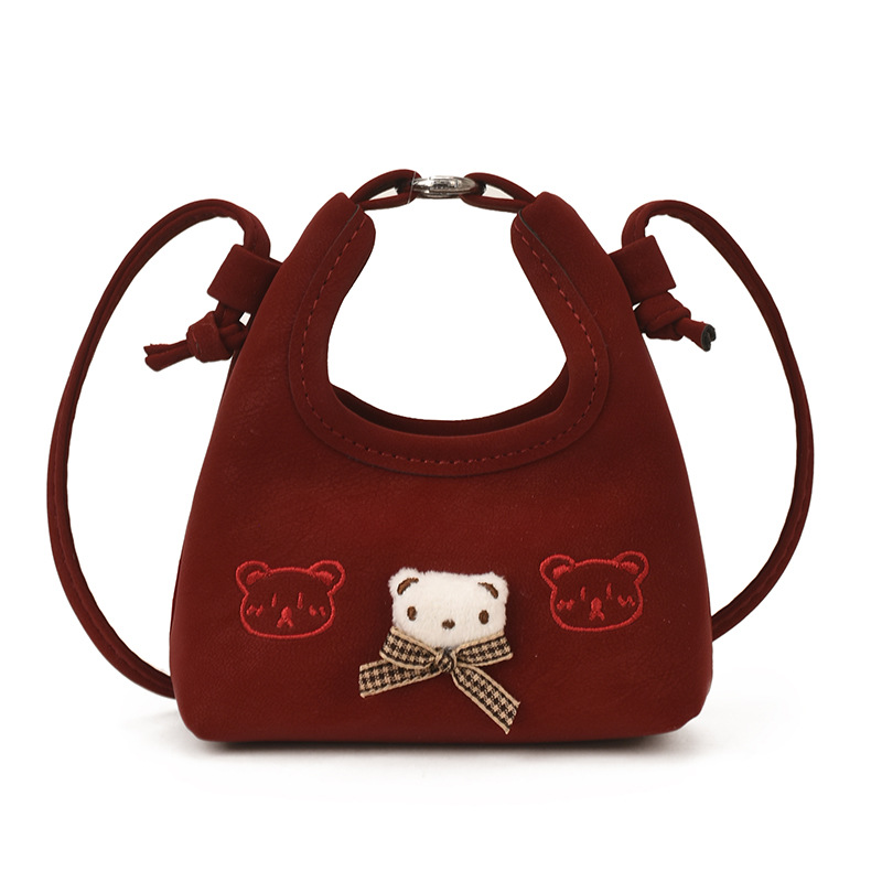 2026 nuevo bolso infantil de dibujos animados osos mini bolso de mano bebé adorable bolso de accesorios de niña pequeña