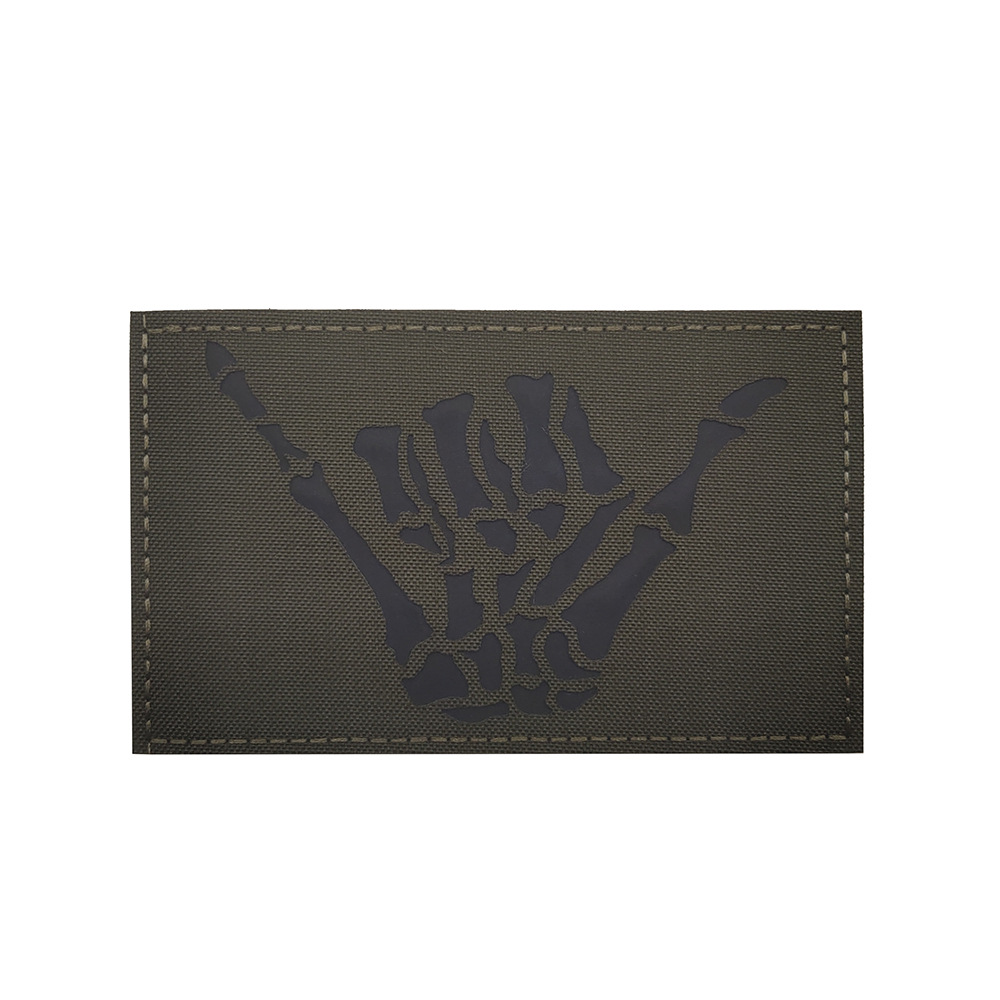 Taiyi copyright suministro en stock Ray cráneo dedo derecho gesto 666IR identificación capítulo velcro luminoso insignia