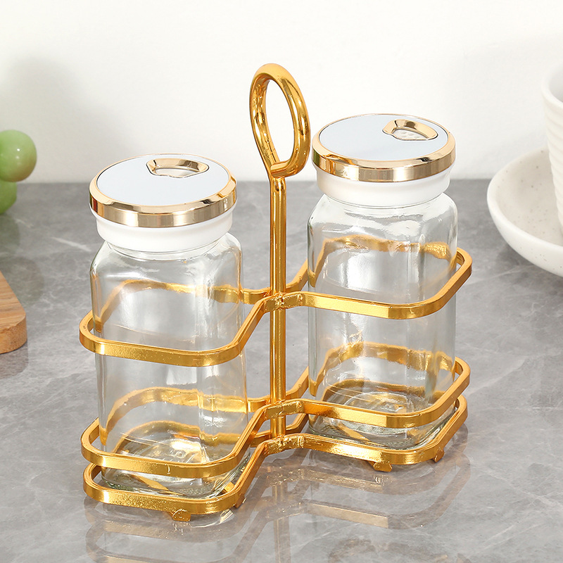 Tarro de condimento de vidrio transparente al por mayor, suministros de cocina, tarro de condimento de sal MSG, juego de botella de condimento creativo de lujo ligero para el hogar