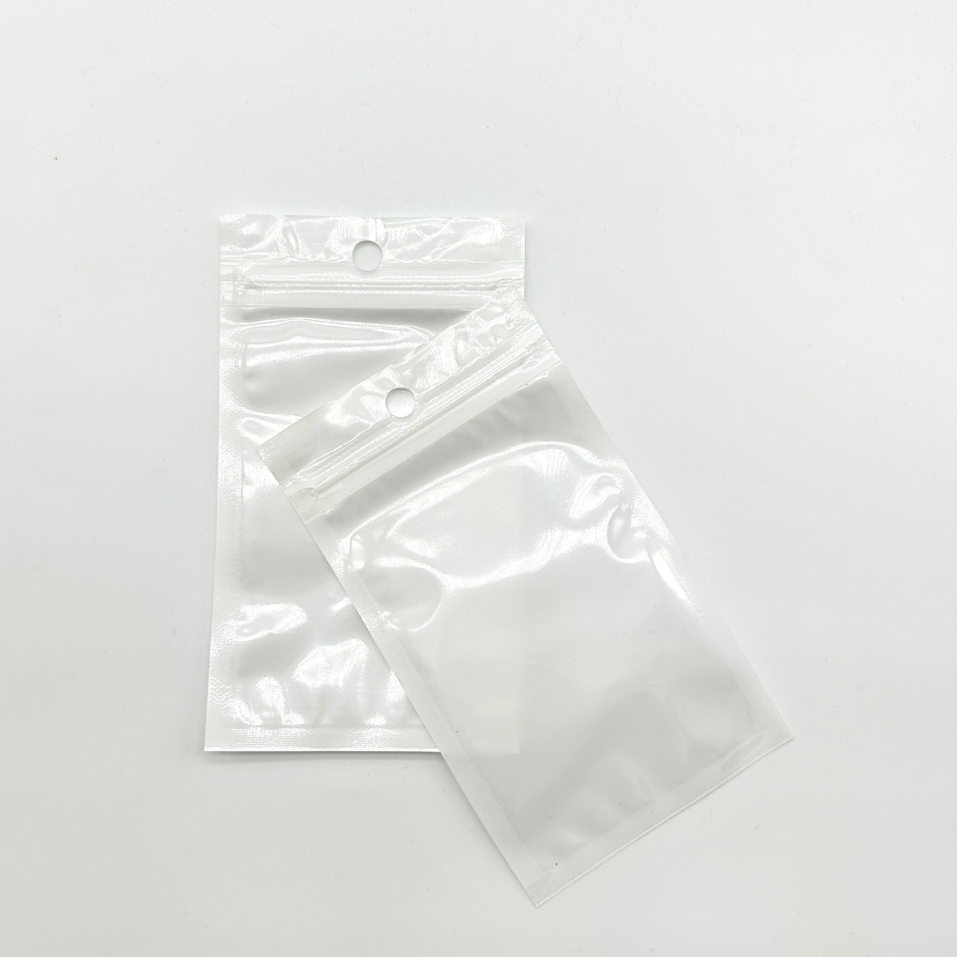 跨境现货珠光袋小饰品包装袋透明阴阳自封袋三边封数码配件袋批发