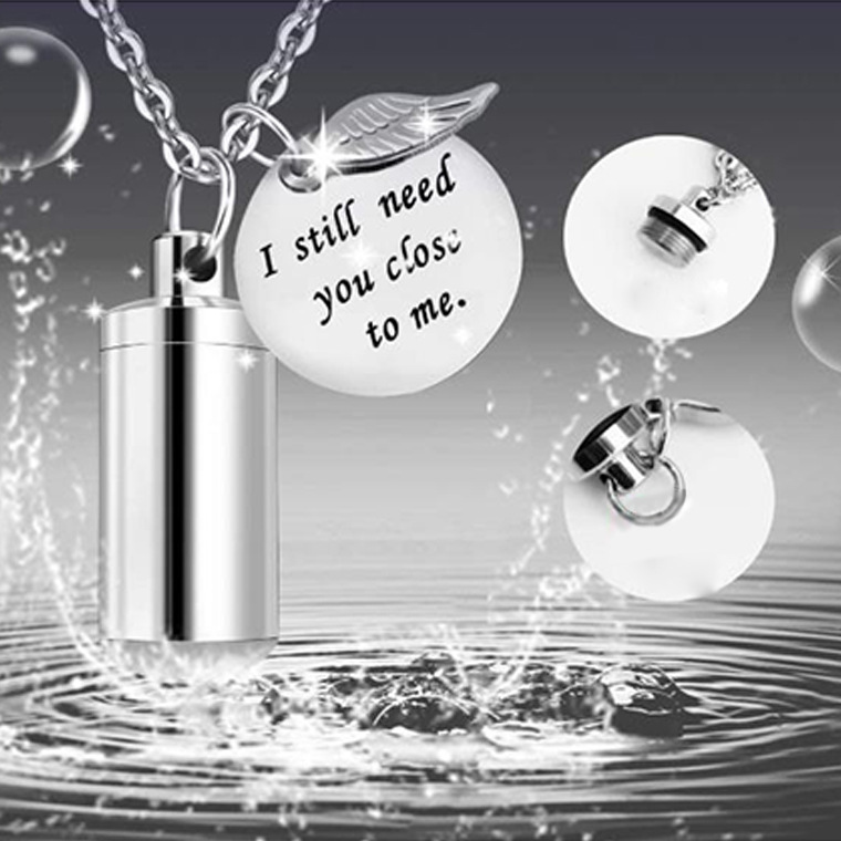 Amazon caliente venta conmemorativa de mascotas cenizas collar hombres y mujeres cilíndricas colgante alas de acero titanio plata colgante