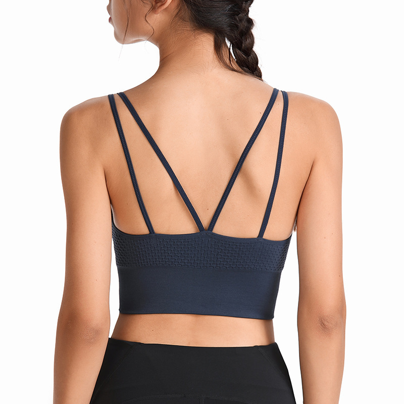 Large women's sports bra with crossover back, shaping and shock absorption, for running, yoga, and fitness.