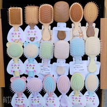 新款卡通可爱批发精品吊卡气垫按摩梳精美设按摩顺发美发梳