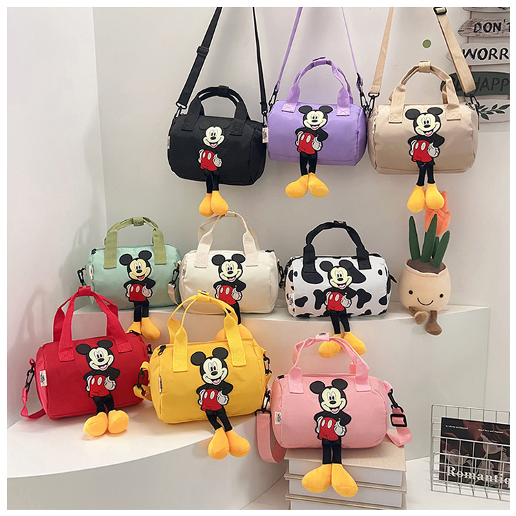 The 2021 new children's bags feature a cute Mickey Mouse pattern bowling bag for girls and a fashionable hand-held shoulder bag undefined