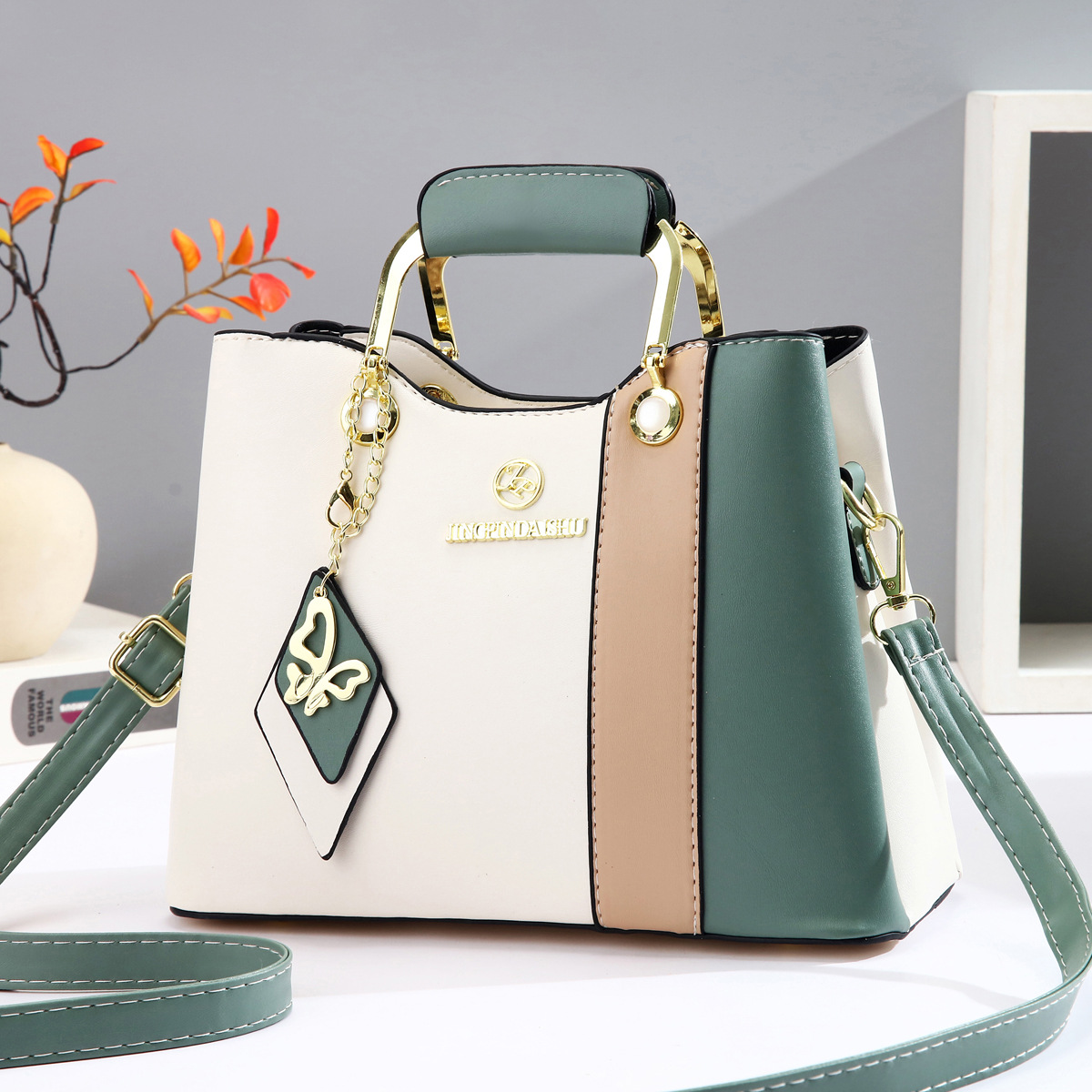 2025 nuevo bolso de mujer de mediana edad de color en contraste bolso de axila casual de todo fósforo bolso de madre de temperamento bolso de mensajero portátil de un solo hombro