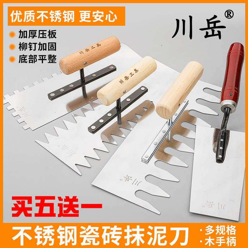 Complete collection of masonry tools, toothed plastering knife, serrated trowel, tile laying trowel, scraper, trowel, masonry batch