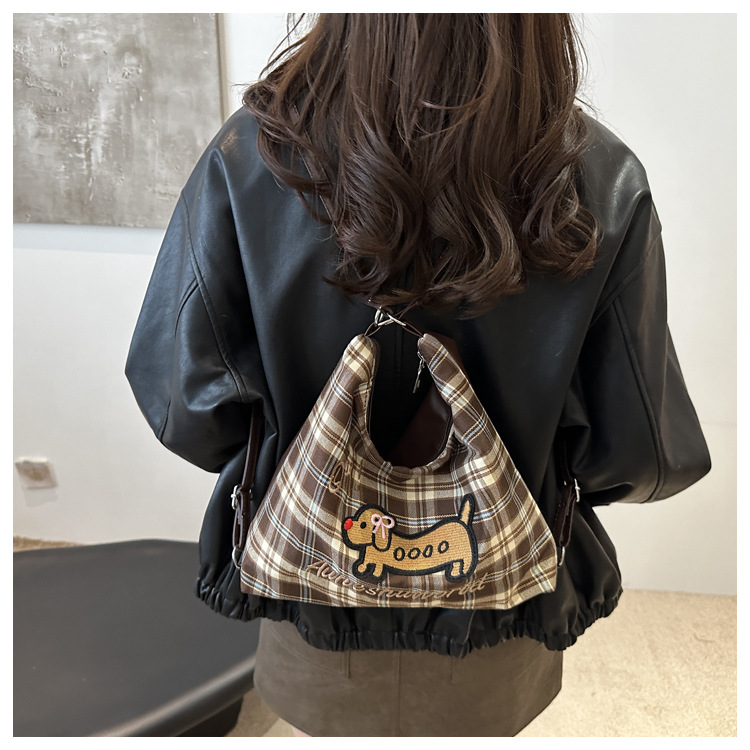 A new 2024 trendy and stylish backpack for women, featuring a cartoon checkered single-shoulder crossbody bag and a tote bag undefined