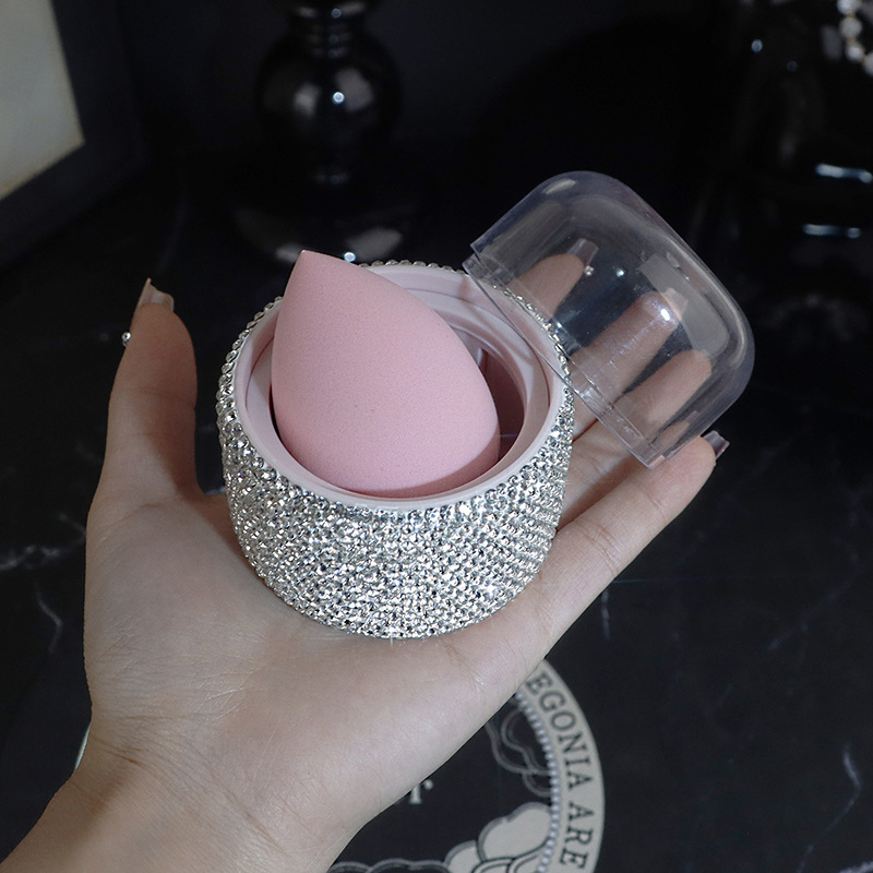 Caja de almacenamiento de huevos de belleza con incrustaciones de diamantes súper suaves a prueba de polvo, maquillaje sin polvo, valor alto, delicado, seco y húmedo, vestido, botella vacía