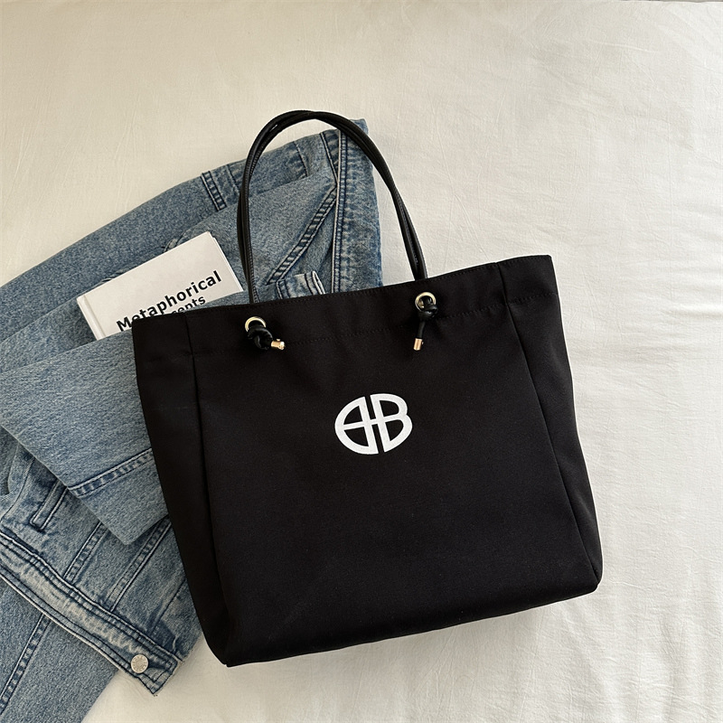 Bolsa de lienzo de gran capacidad de letras para mujeres este año nueva bolsa de hombro de moda universal bolsa de viaje bolsa de mano bolsa de mamá