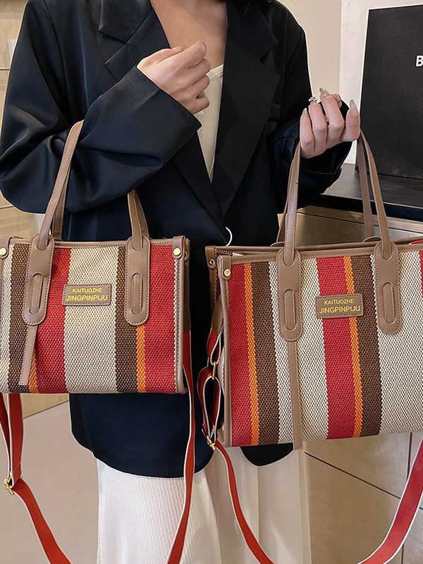Bolso Tote portátil a rayas de color de contraste de lona para mujer 2024 nueva textura de moda transfronteriza bolso de mensajero de un solo hombro