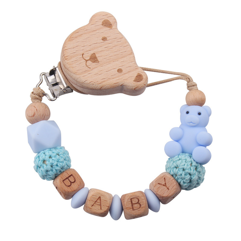 Nuevos productos para la madre y el bebé, clips de oso de haya, juguetes de dientes apretados para bebés, cadena de chupete de oso de oso de animales de dibujos animados