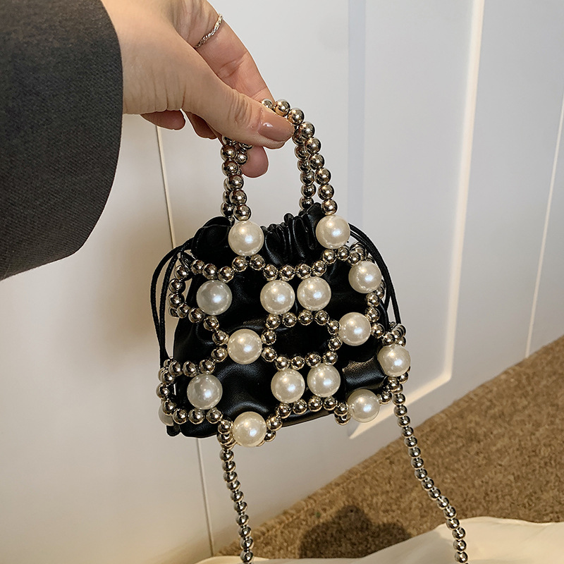 Versión coreana del nuevo estilo de verano bolso de mensajero para niños lindo perla bolso para niños y niñas mini bolso de hombro para niñas de estilo occidental