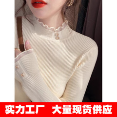包みの糸の生地の底のシャツの秋冬のファッションの洋風の中でレースの半高襟のセーターを掛けて百合の修身の上着を着ます。