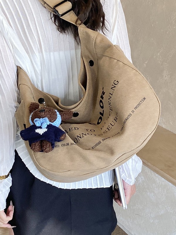 Bolsa de lona para mujeres 2026 nueva bolsa de gran capacidad transfronteriza impresa letras de viaje casual mochila de hombro