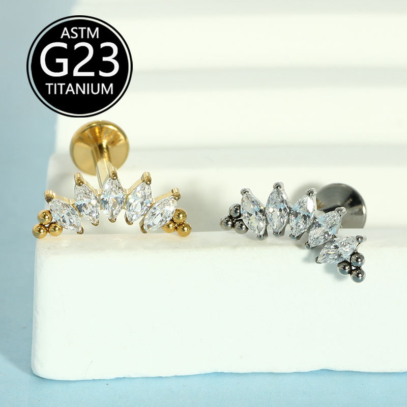 Silver pointed spike labret stud material detail