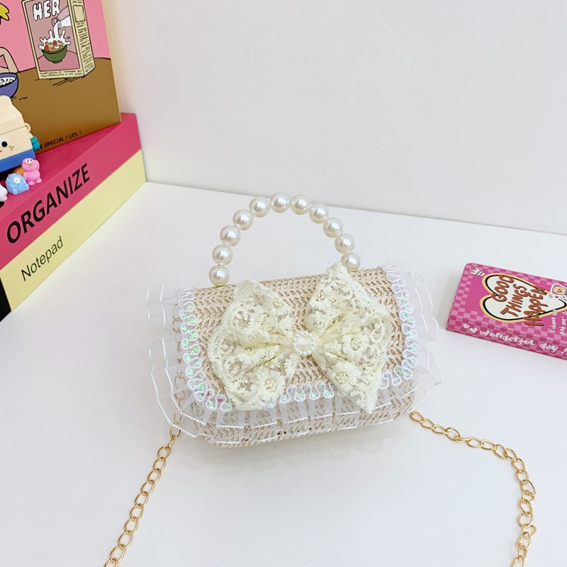 Verano nuevo arco de paja bolso de perla bolso de moda para niños bolso de princesa de jardín de infantes