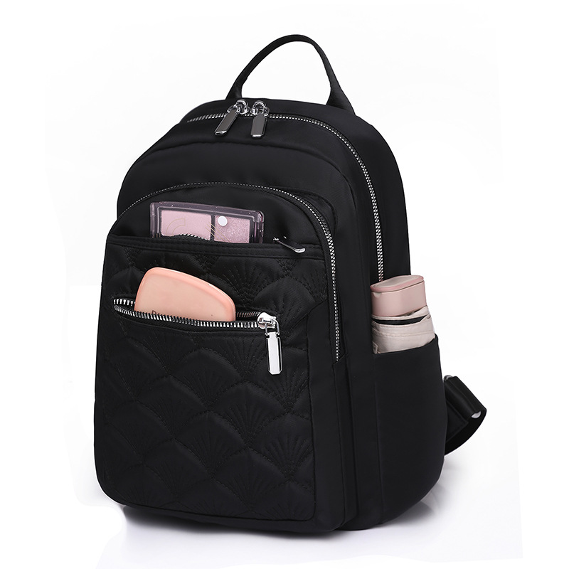 2024 nueva mochila de nylon bordada casual para mujer simple y ligera mochila de viaje de viaje urbano mochila escolar de moda