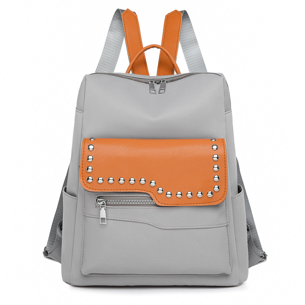 Nueva mochila con remaches para mujer de color en contraste, mochila de viaje simple y versátil de gran capacidad, mochila de viaje al aire libre, al por mayor