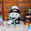 Black sweater, hat, white bag