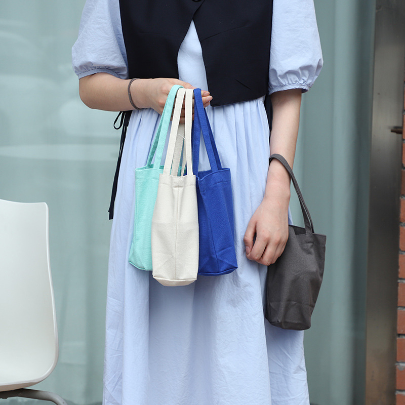 Bolso de taza portátil fresco bolso de Corea del Sur bolsa de lona Portátil Bolsa de cosméticos para niñas bolsa de almacenamiento de embrague