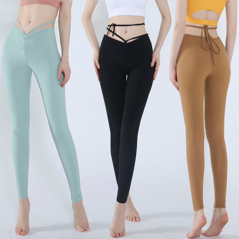 Pantalones de yoga para mujer 2021 Nuevos pantalones cortos ajustados con cordones de cintura alta desnuda corriendo baile de secado rápido pantalones de fitness elásticos altos