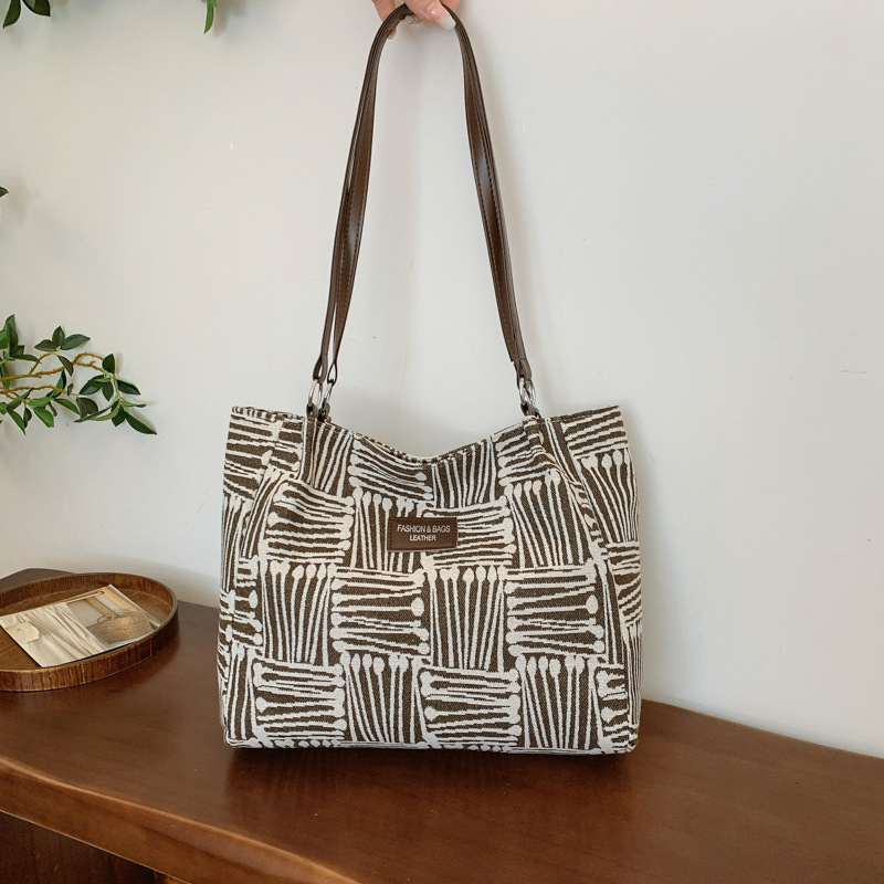 Bolsa multipropósito coreana de hombro de mujer, nicho de diseño de textura portátil, bolso de hombro de mujer, pequeño bolso fresco.